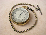 Early 20th century pocket barometer signed Harrods London.